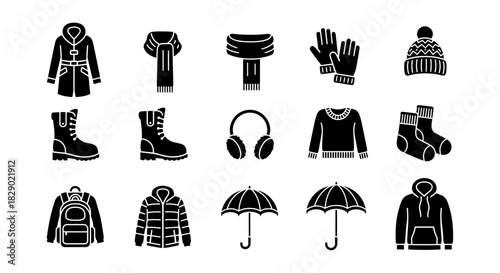 Winter fashion essentials in black silhouette style: clothing and accessories icons set