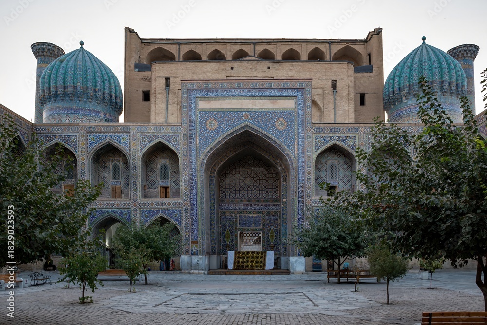 Naklejka premium Historic Madrasa with Turquoise Domes and Blue Ceramic Tilework