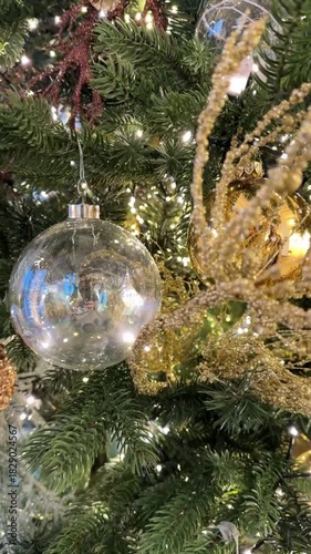 Clear Glass Christmas Baubles With Lights On Pine Tree Video