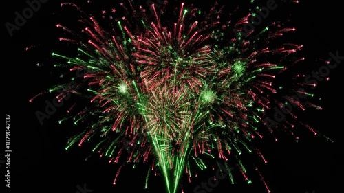 A vibrant, close-up explosion of red and green fireworks with glowing sparks, isolated on a transparent background for celebratory designs