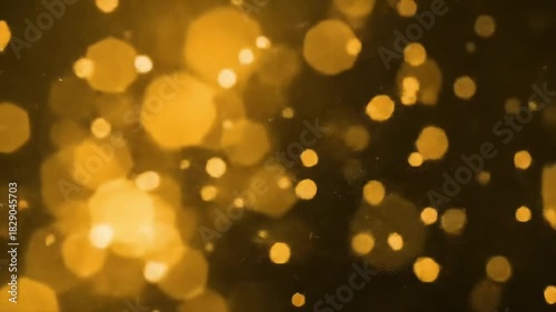 A golden bokeh background features blurry, sparkling lights against a dark backdrop, creating a dreamy, hazy effect