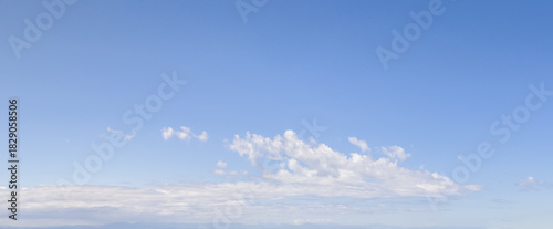 Bright Blue Sky With Wispy Clouds Over Calm Horizon – Cloudscape Background