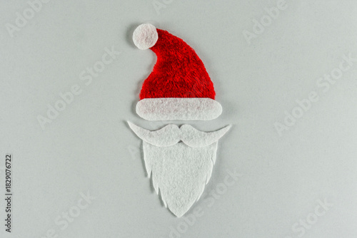 Santa Claus symbol on white background. Handmade winter Holidays concept 