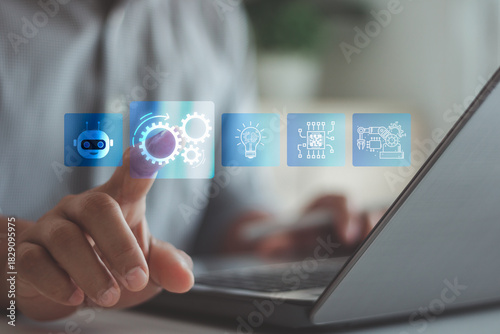 RPA, Robotic process automation, artificial intelligence concept. Man use laptop with virtual automation technology to automate business tasks with AI. Digital transformation and change management.