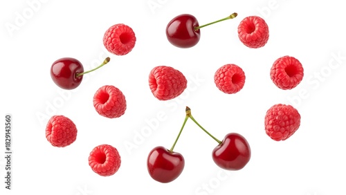 Delicious cherries and raspberries floating on white background for healthy summer food concepts