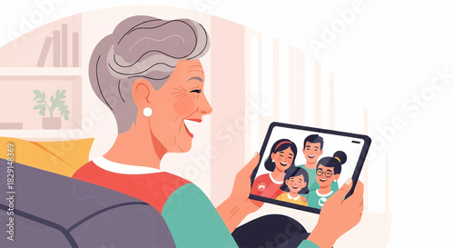 Elderly woman enjoying a video call with family on a digital tablet at home.