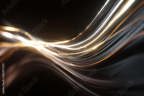 Abstract streaks of glowing light flow and shimmer against a dark background suggesting movement and energy
