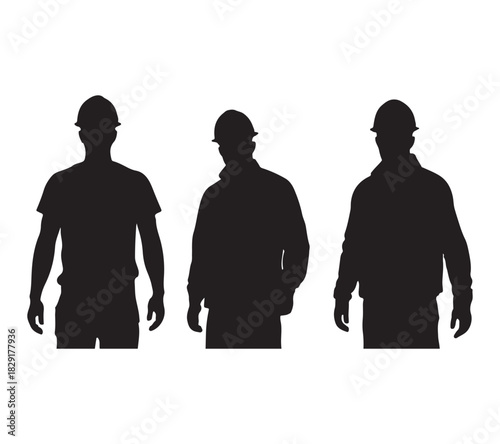  Three construction workers wearing hard hats standing together as a silhouette