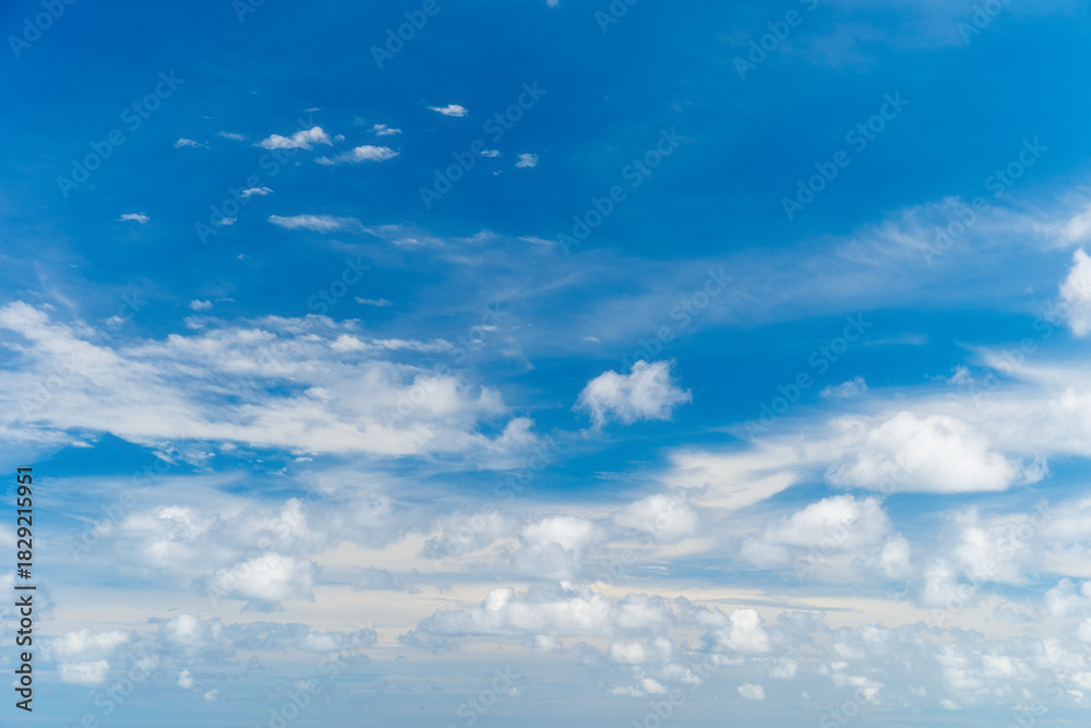Obraz premium clear blue sky with little clouds in daylight for cyan bright skyscape to white cloudscape or ozone scene and beautiful nature background with freedom copy space use cpl circular polarized filter