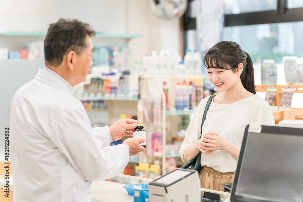 Obraz premium A woman who came to the pharmacy to pick up a prescription or shop 
