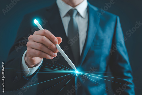 Businessman in a suit uses a digital pen with glowing light to create futuristic designs and concepts showcasing innovation and technology in business