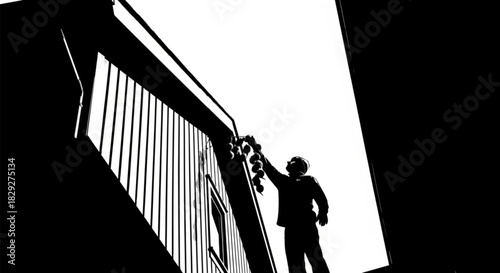 Noir style black and white silhouette of a man holding a bunch of grapes.