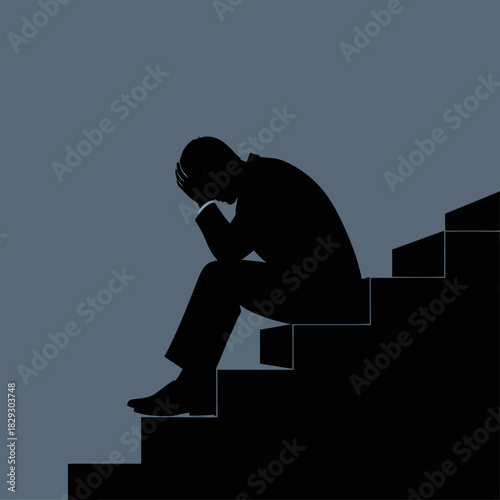 Silhouette of a man sitting on stairs, head in hands, depicting sadness and despair.