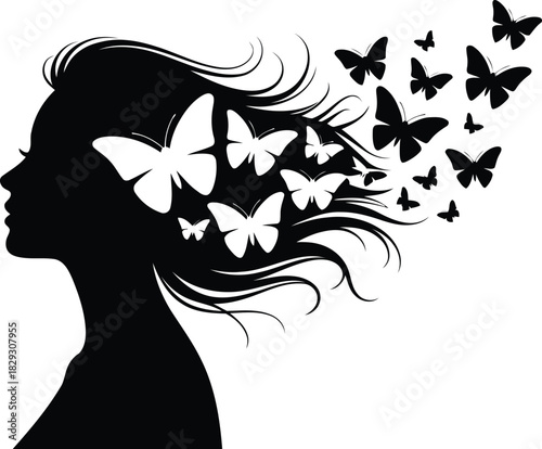 Stylized womans silhouette showcasing numerous butterflies taking flight from her hair