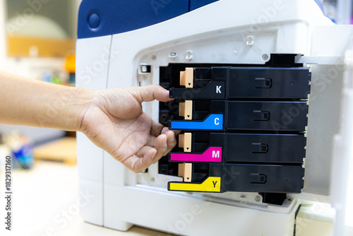 Technician Holding ink printer toner low for replace new or fix repair problem paper or print scanning fax or copy document or photocopier or photocopy office workplace equipment concept