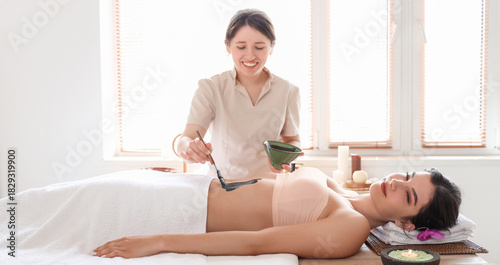 Massage therapist applying ...
