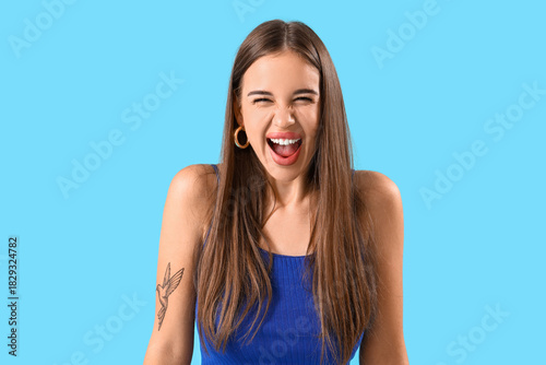 Beautiful young woman screa...
