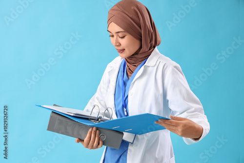 Female Muslim doctor with f...