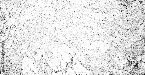 Abstract monochrome background texture displaying a distressed grunge effect with scattered black specks and dust creating a vintage artistic overlay design