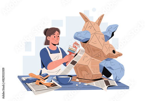 Woman artist painting a cardboard giraffe sculpture, creative craft project, diy home decor ideas, art class inspiration, recycled materials artwork.