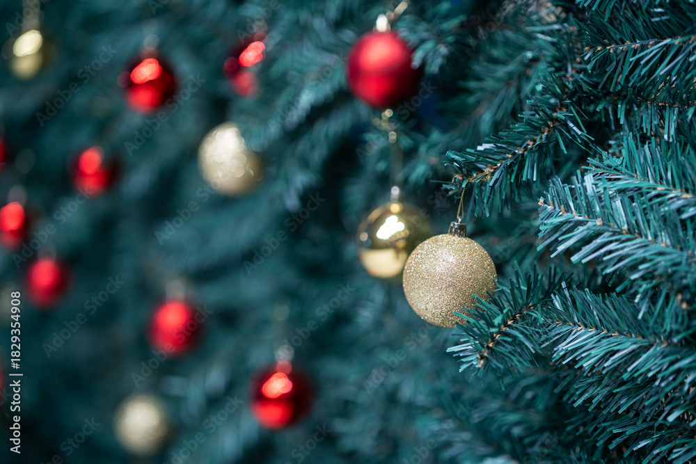 Obraz premium Merry x-mas,Close up of Colorful balls ,gifts box and Christmas greeting picture parcel,bell decoration on Green Christmas tree background Decoration During Christmas and New Year.