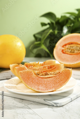 Cuadro en lienzo Fresh Honeydew Melon Slices with Yellow Cantaloupe on White Plate - Healthy Summ
