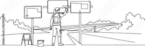 Roadwork safety worker updating directional signs on the highway