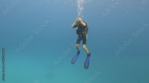 The diver is in a state of neutral buoyancy.