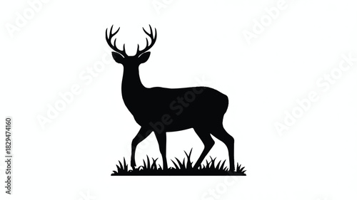 A black silhouette of a majestic deer standing in tall grass against a white background.  