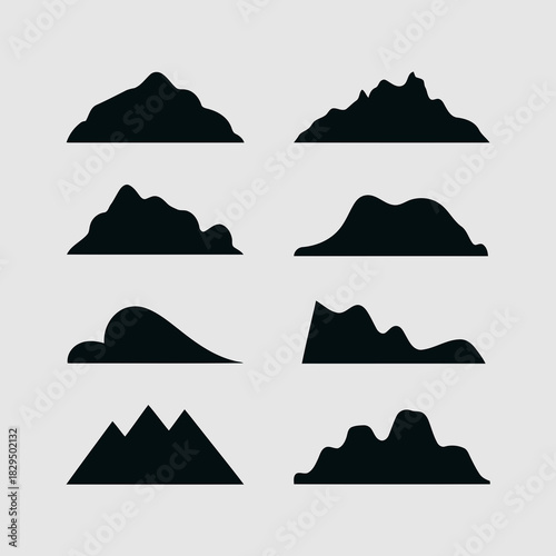 Set of nine different mountain silhouettes isolated on