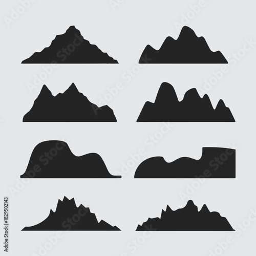 Set of nine different mountain silhouettes isolated on