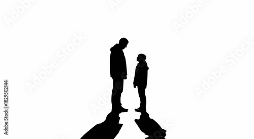 High contrast silhouette of a parent and child standing together.