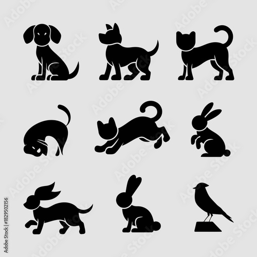 Set of black silhouette icons of various animals including dogs, cats, rabbits, and birds