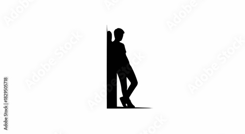 Black silhouette of a young man leaning against a wall.