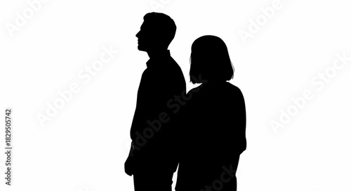 Silhouette of a man and woman standing side by side, looking in opposite directions.