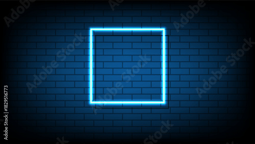 Blue neon square frame on a dark brick wall background with copy space for text