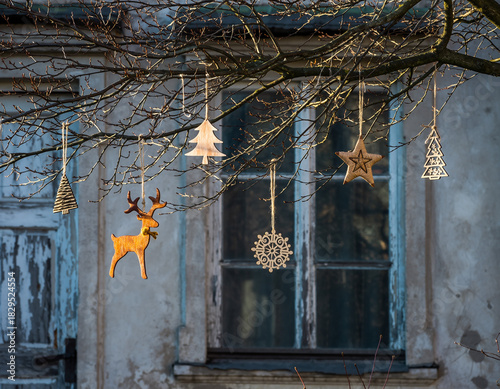 Wallpaper Mural Twinkling Christmas Decorations Hanging from a Bare Tree Torontodigital.ca