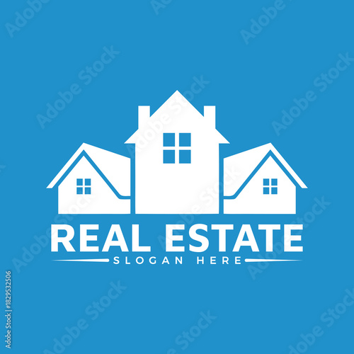 White silhouette of three houses forming a real estate logo design with text slogan on a solid blue background for property business