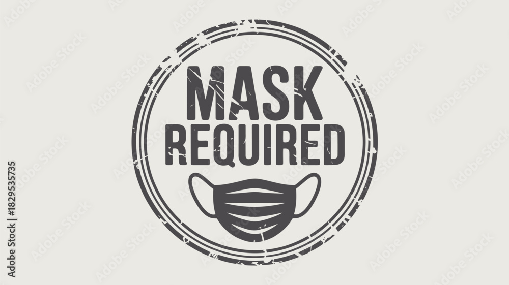 Obraz premium A circular stamp with the words mask required and a face mask illustration in a grunge style design