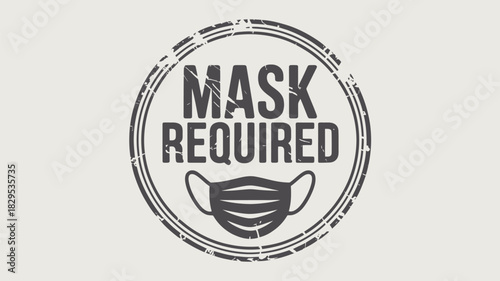 A circular stamp with the words mask required and a face mask illustration in a grunge style design