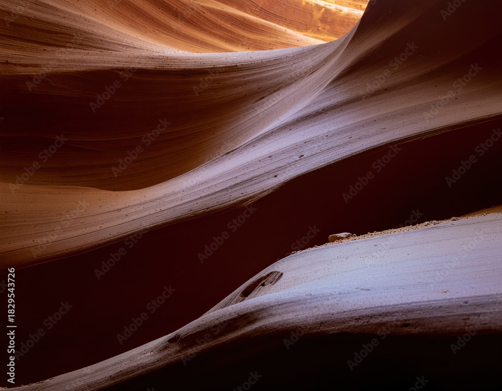 Obraz premium Abstract Winding Sandstone Canyon Walls With Dramatic Light And Shadow In Warm Earth Tones