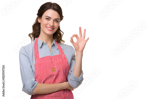 Smiling woman wearing apron doing okay sign standing isolated on transparent looking at camera cheerful happy positive