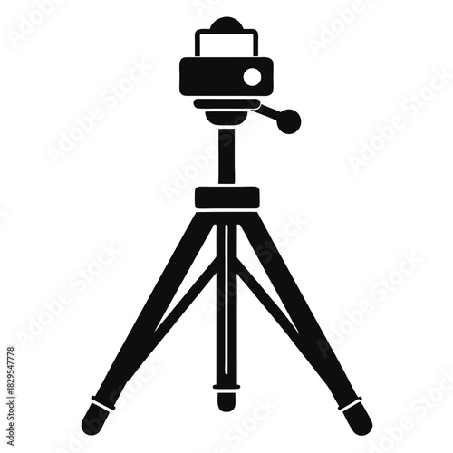 A black simplistic camera tripod ensures a stable shot with its secure mounting design