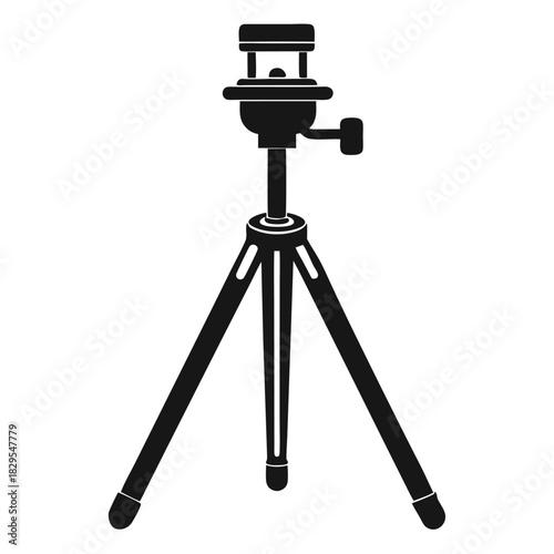 Black photographic tripod stands ready, exhibiting stability and professional design for capturing precise shots