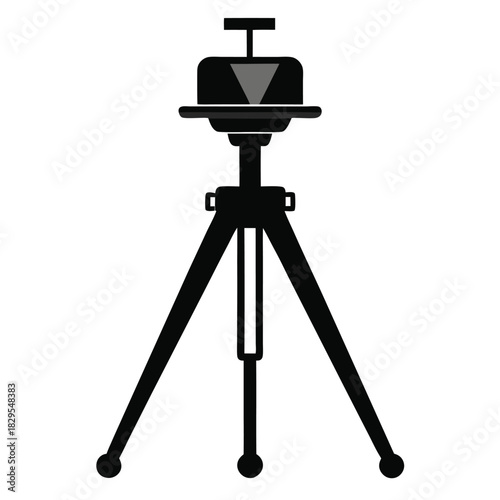 A simple black tripod standing tall with its balanced structure against white backdrop