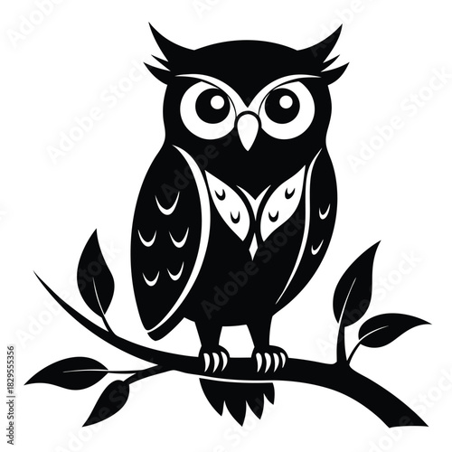 Black silhouette of owl perched on a leafy branch looks straight ahead with round eyes