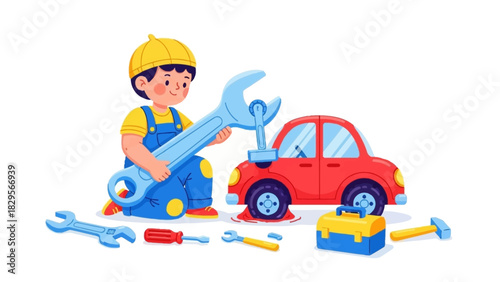 A young boy dressed as a mechanic uses a large wrench to repair a small red toy car with a flat tire, isolated on a white background