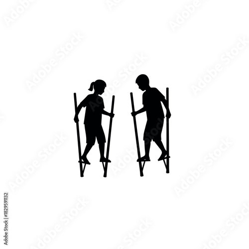 Children on stilts silhouette traditional game outdoor activity childhood fun.