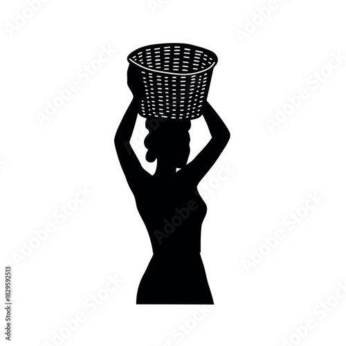 Silhouette of a woman carrying a basket on her head traditional style.