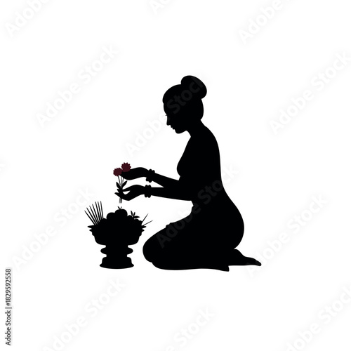 Silhouette of a woman offering flowers.